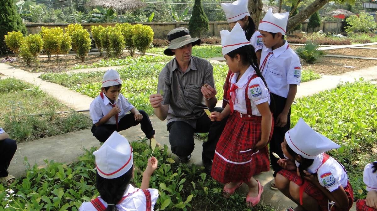 WIDESPREAD BENEFIT: Dr Stephen Ives teaching Vietnamese students about forage production in Dien Bien Province. Picture: Supplied