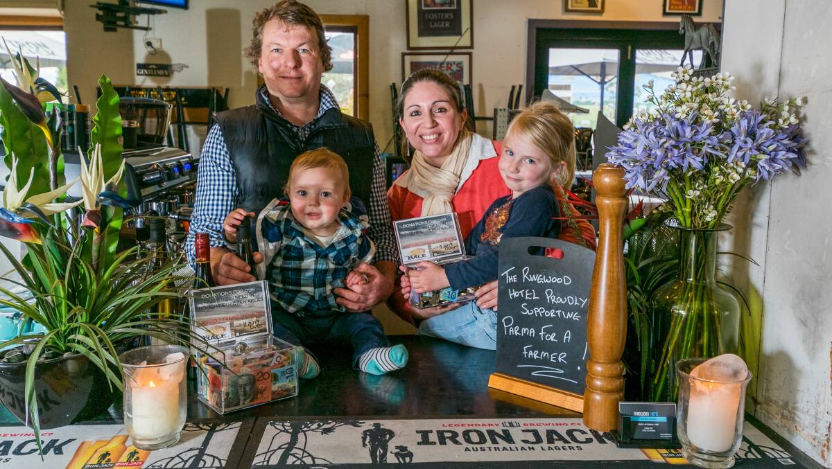 SUPPORTING THE FARMING COMMUNITY: Rachel Cornelius and Jay Piggott, with Felicity, 3, and Carter, 11 months. Picture: Phillip Biggs