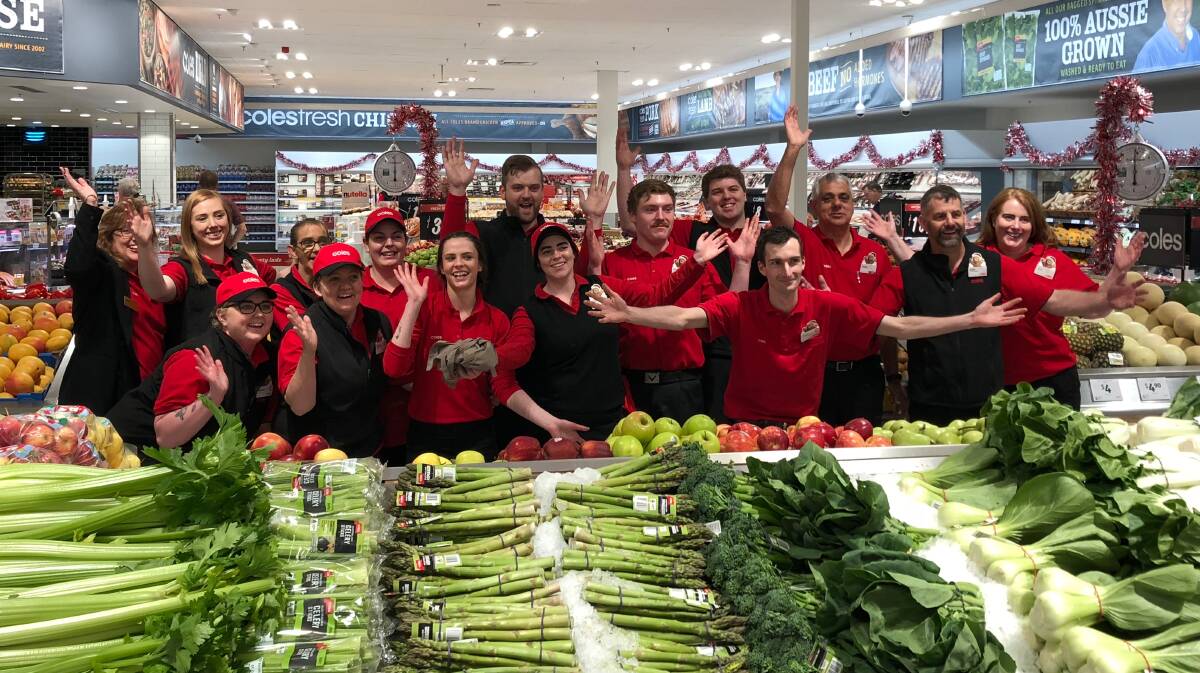 FRESH START: Coles Racecourse Crescent staff, including new recruits, welcome customers to the new-look store on Wednesday. Picture: Supplied