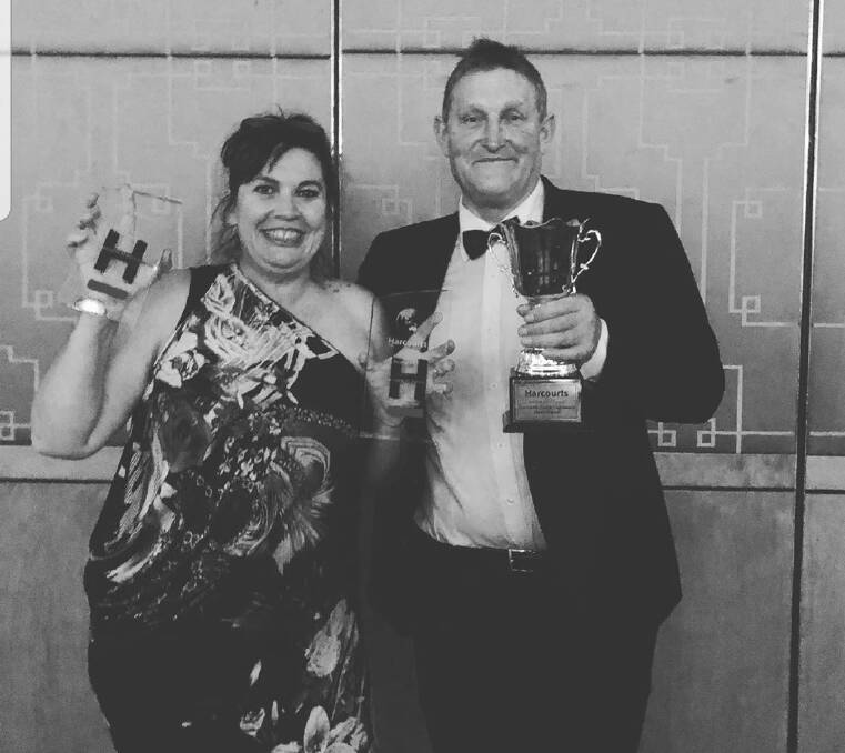 TAKING ON THE WORLD: Harcourts St Helens franchisees Kate and Graeme Chapple at the Harcourts awards event. Picture: Supplied