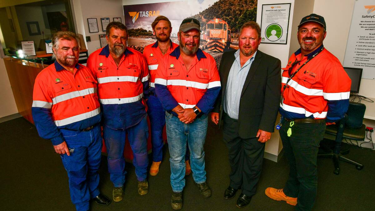 CLOSE SHAVE: TasRail's Kevin Lawrence, Peter Standaloft, Dylan Twine, Adam Willis, chief executive Steven Dietrich and Chris Baric. Picture: Scott Gelston.