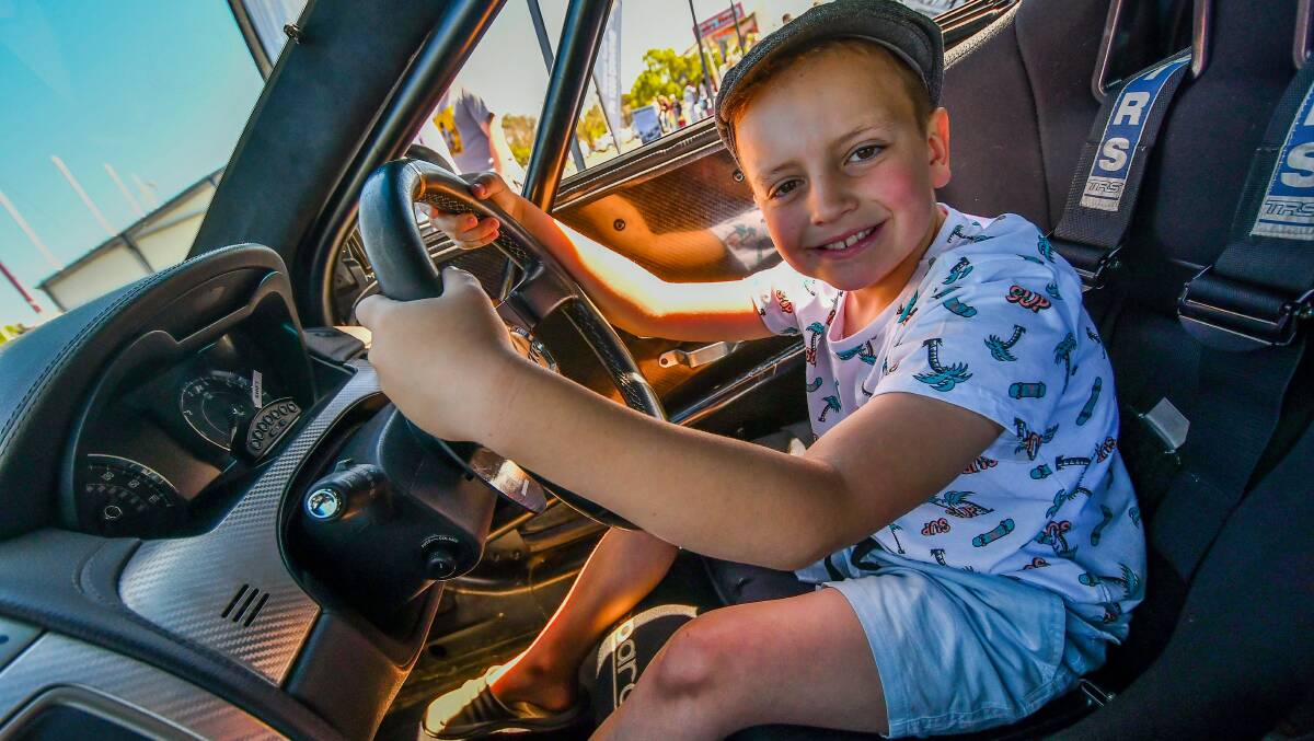 Jasper Midson, 8, of Newnham, behind the wheel of a Jaguar XKR from Performance Driving Australia at the Royal Launceston Show.