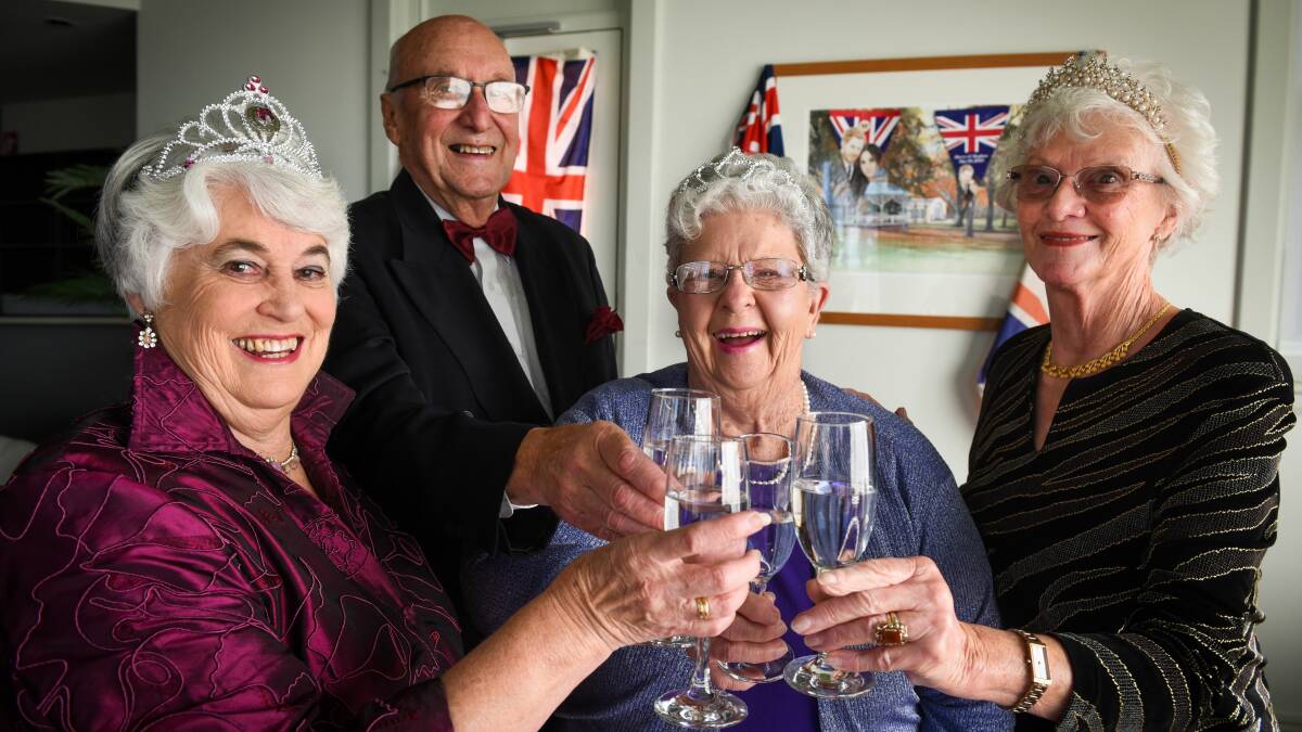 CHEERS: Glenara Lakes residents Gayle Carroll, John and Helen Burgan and Margaret Meyer prepare for a themed cocktail party before the royal wedding on Saturday night. Picture: Paul Scambler