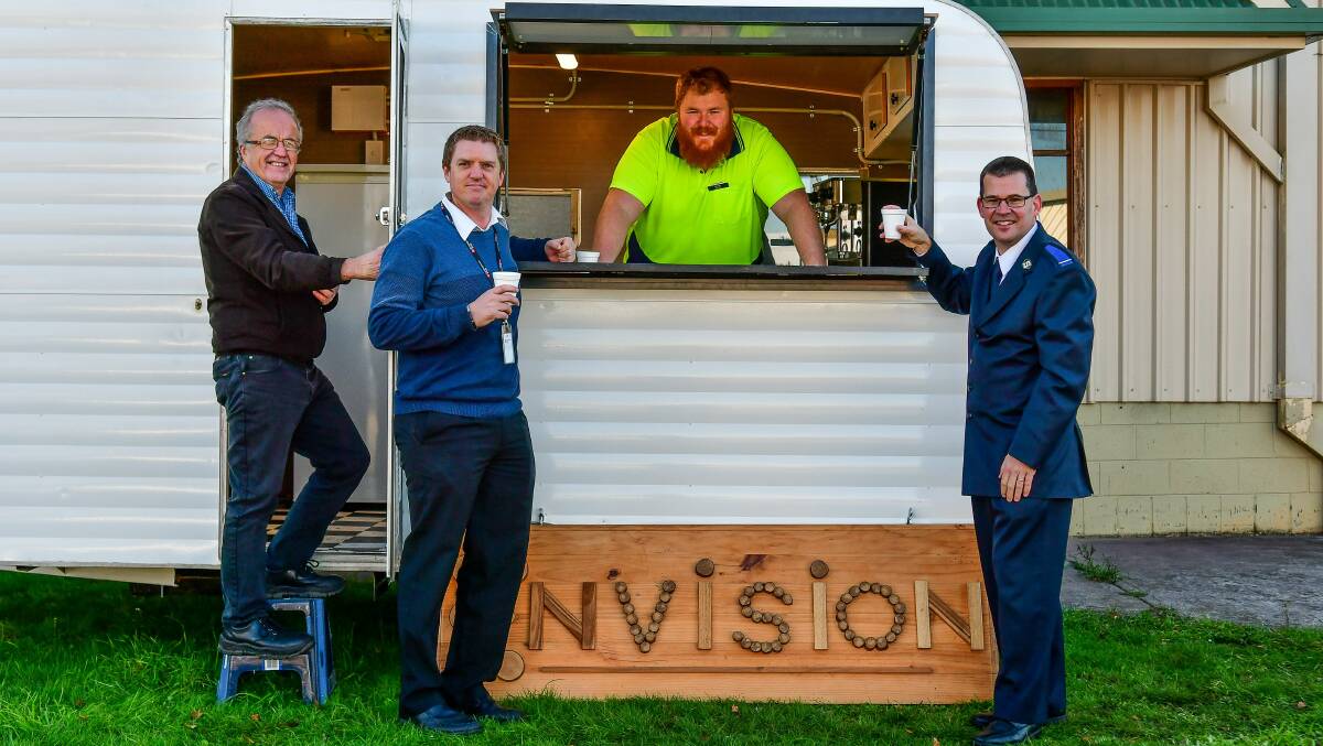 ORDER UP: Envision's Stephen Murphy, Ji Clark, Envision supervisor Dylan Oakenfull and Roderick Brown with the finished coffee cart. Picture: Scott Gelston