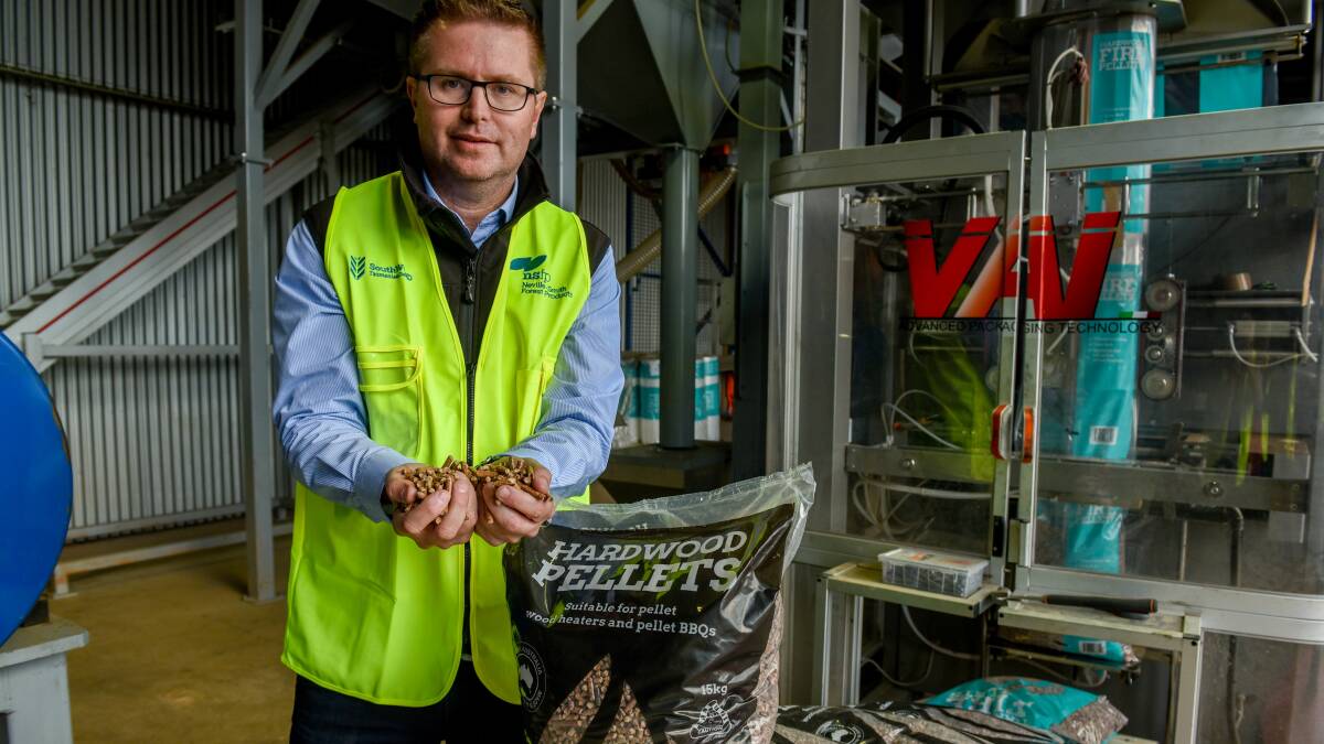 Andrew Walker with the hardwood pellets the business produces at Mowbary. Picture: Paul Scambler