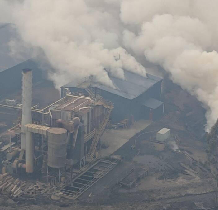FIRE ATTACK: Aerial shot of Southwood mill during the Huon Valley bushfires. Picture: TFS