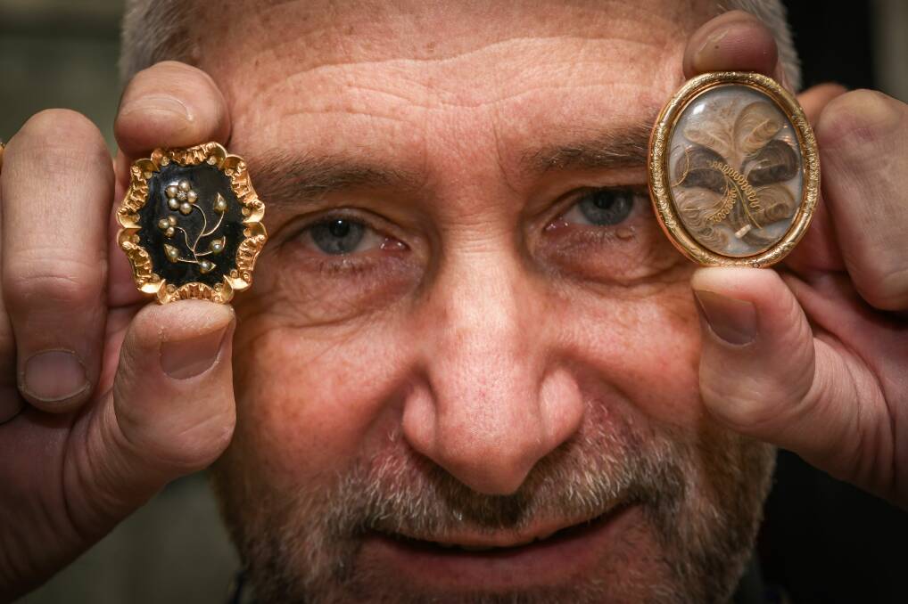 MEANINGFUL PIECES: SJ's City Cash owner Bill Lowe with the 1840s and 1838 hair jewellery. Picture: Paul Scambler