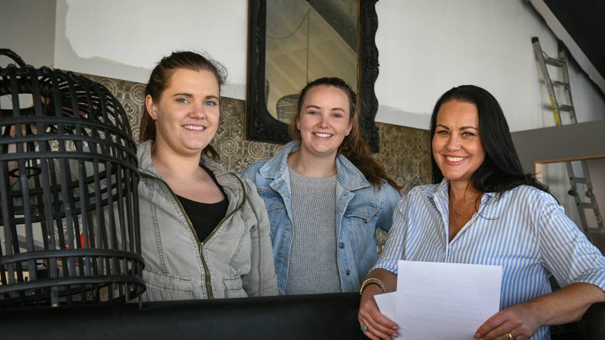 NEW CATCH AT SEAPORT: Restaurant chef Paige Anning, manager Bec McDonald and owner Karen Burbury setting up the venue. Picture: Paul Scambler