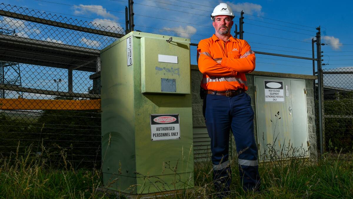 LIFE THREATENING: TasNetworks ground services team leader Steve Sergent outside a substation similar to the one vandalised in Prospect, causing two power outages. Picture: Scott Gelston