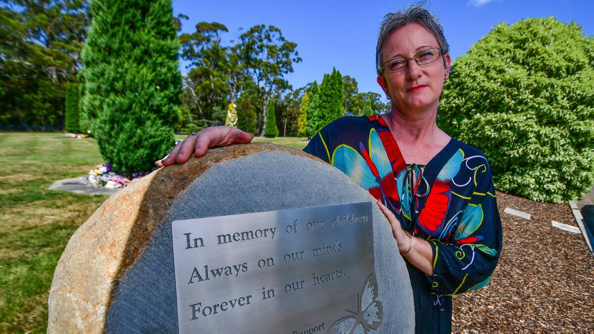 IN LOVING MEMORY: Lisa Bird with the new plaque, created in her son's honour, for the children's cemetery at Carr Villa. Picture: Scott Gelston