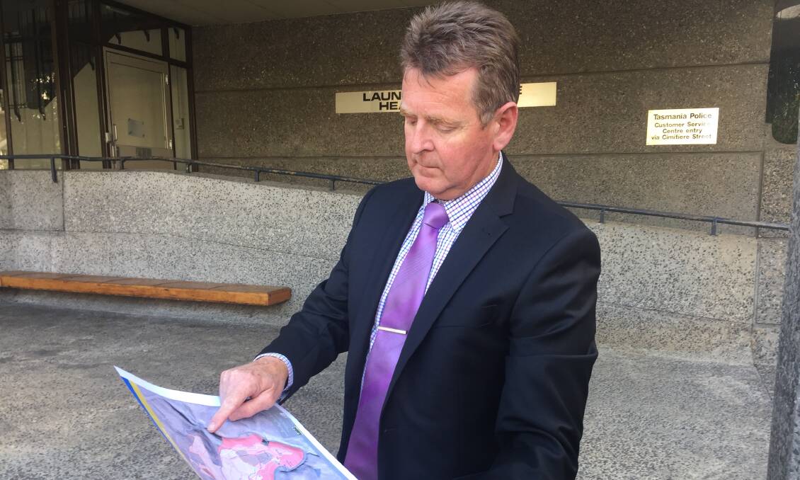 ASSAULT INVESTIGATION: Detective Senior Sergeant John Parker shows a map of Trevallyn Reserve, where a 30-year-old woman was attacked on Sunday. Picture: Johanna Baker-Dowdell