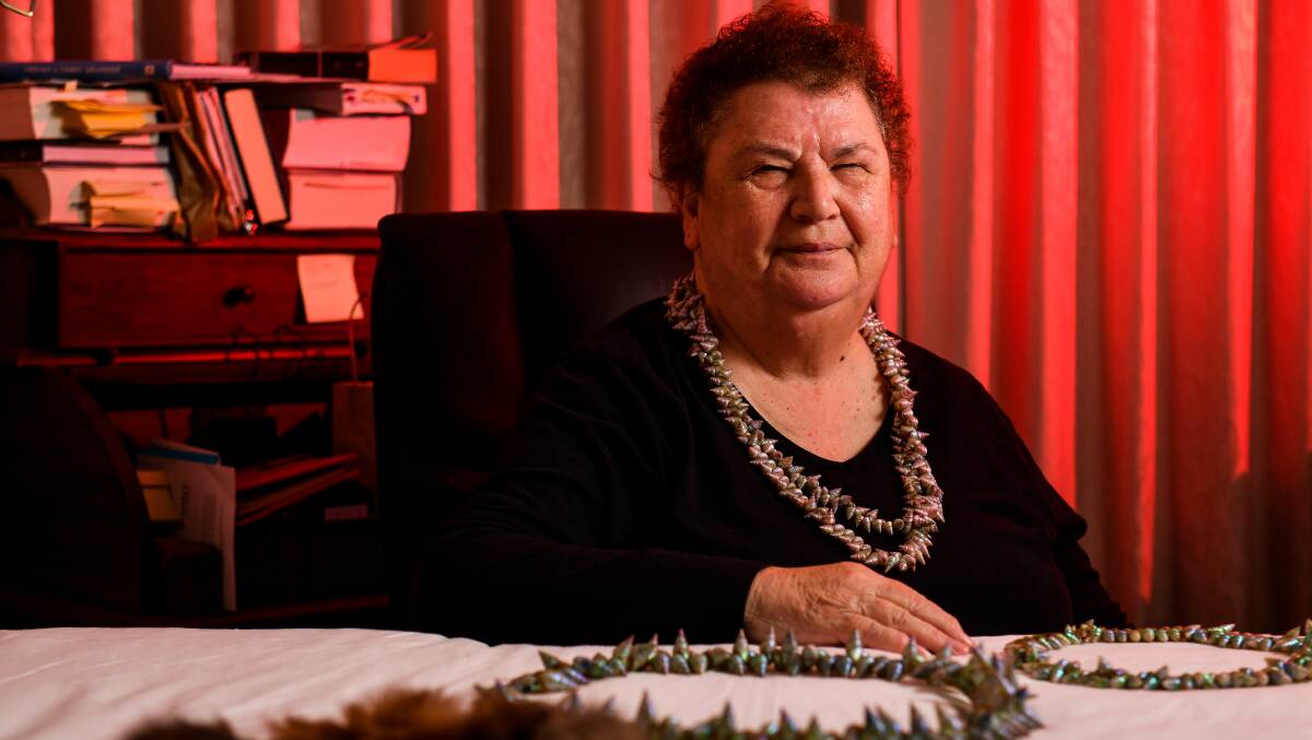 A LIFE'S WORK: Aunty Lola Greeno displays necklaces of threaded mariner shells, created using a practice passed down through generations. Picture: Scott Gelston