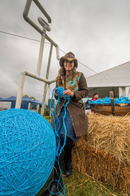 Artist Jacqueline Thomson working on Blue Farmer at the Tasmanian Craft Fair for the Looking out for Each Other project. Picture: Phillip Biggs