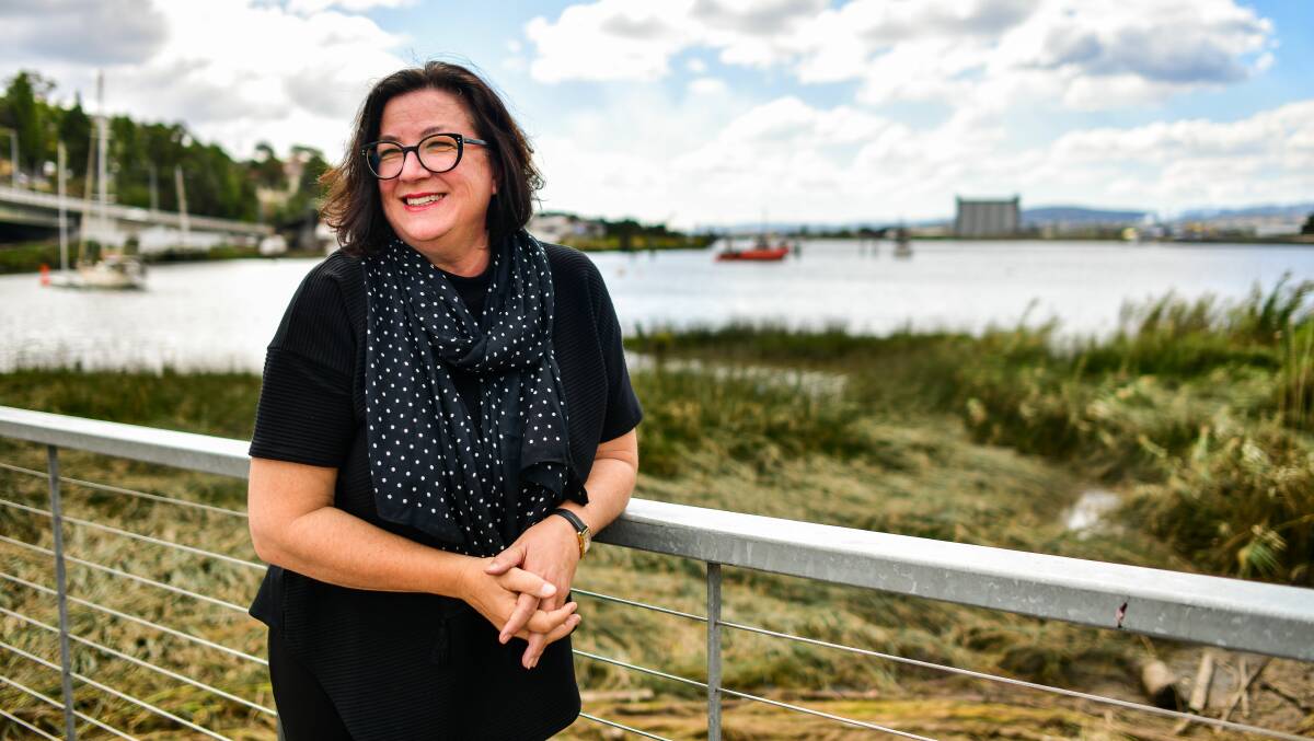 HONOURING HER ROLE: Kim Seagram stands on the Tamar River boardwalk outside Stillwater. Picture: Scott Gelston