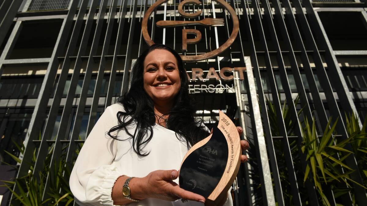 DIGITAL TRANSFORMATION: Cataract on Paterson owner Karen Burbury, holding the 2018 Premier's Award, and her team to increase digital skills. Picture: Paul Scambler