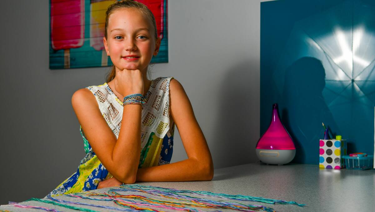 HIGH ACHIEVER: Chloe Payne with a selection of friendship bracelets she made for grieving siblings. Picture: Scott Gelston