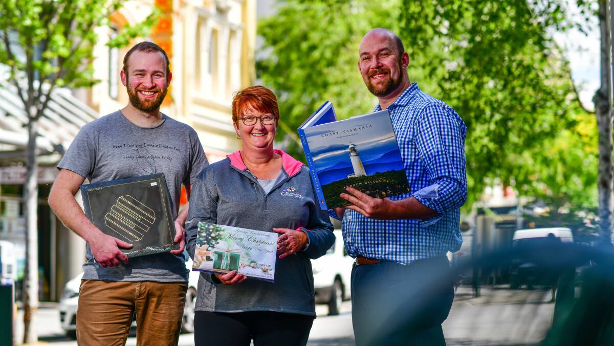 BUY LOCAL THIS CHRISTMAS: Avenue Records owner Callum Nobes, Gourlays manager Steph Bowden and Petrarch's manager Marcus Durkin. Picture: Scott Gelston