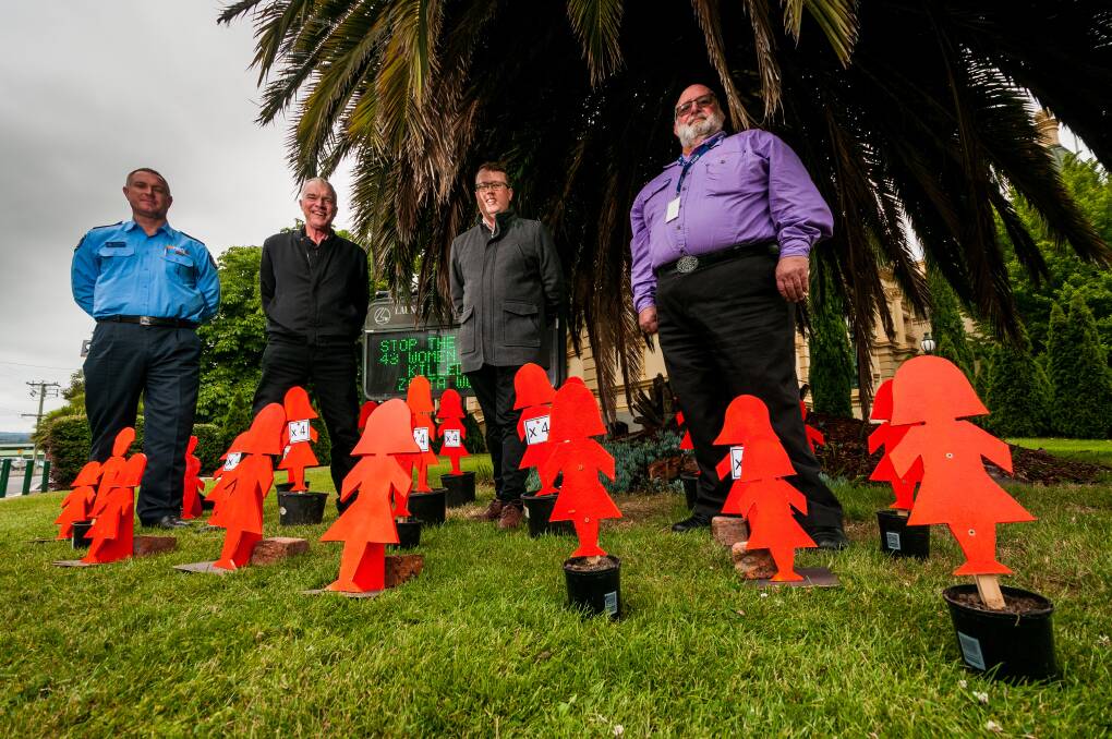 James Newstead of TFS, Launceston White Ribbon community partner Phil Crowden, Corey Martin of The Examiner and Court support officer Brad Hapner, with figures which represent female family violence deaths this year, at the Mentors in Violence Prevention workshop at Albert Hall. Picture: Phillip Biggs The Examiner.