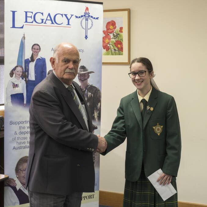 Launceston Legacy president Russel Hogarth presenting St Patrick's student Gabriella Smith with first place. Picture: Supplied