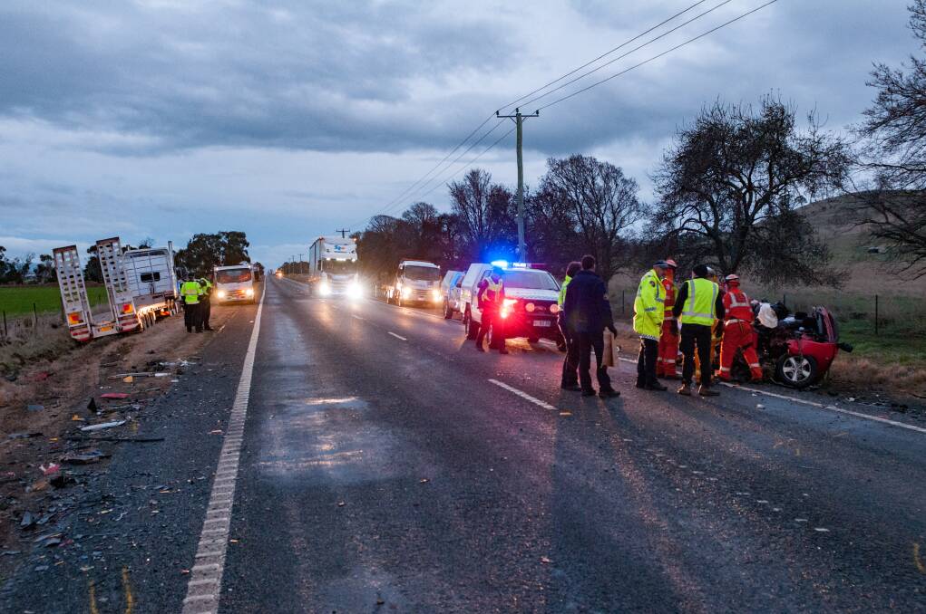 Emergency services attend to the scene on the Midland Highway near Campbell Town. Picture: Phillip Biggs