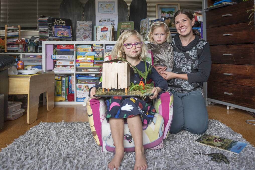 HOME EDUCATION: Sarah Loft (right) with daughters Marnie, 3, and Nadine (left), 6, teaches Nadine from home. Picture: Craig George