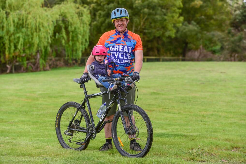 Charity cycle: Justin Stevens and his 21-month-old daughter Alice are riding throughout October to raise money for childhood cancer research. Picture: Paul Scambler The Examiner.