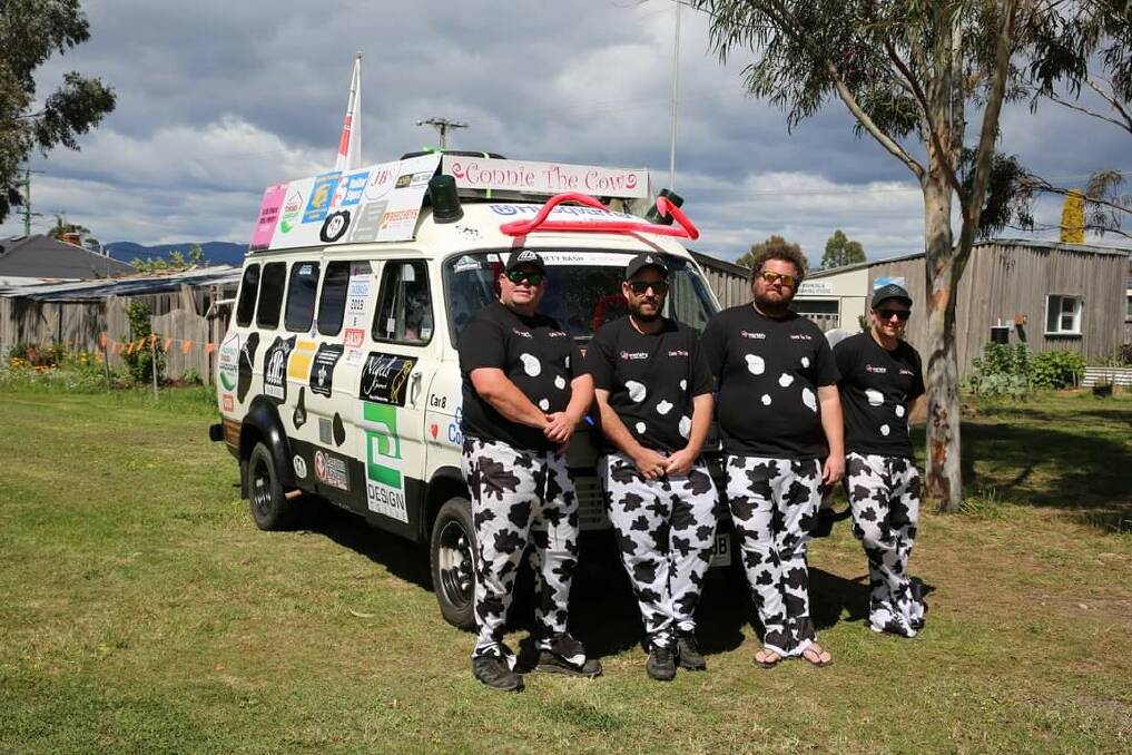 Udderly delightful: Matthew Richards, Kane Spencer, Matthew Bessel and Daniel Smith with their 1973 Ford Transit called Connie the cow. Picture: Supplied.