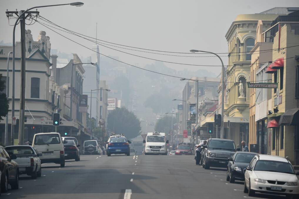 SMOKEY: Smoke hanging in the air over Launceston CBD continues to be a feature on frosty Autumn days. Picture: File