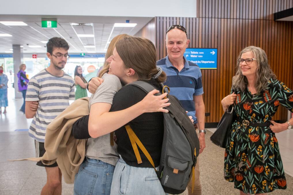 FINALLY HOME: Sophie Burgess had not embraced her sister, Nichole Burgess, for a year. Picture: Paul Scambler