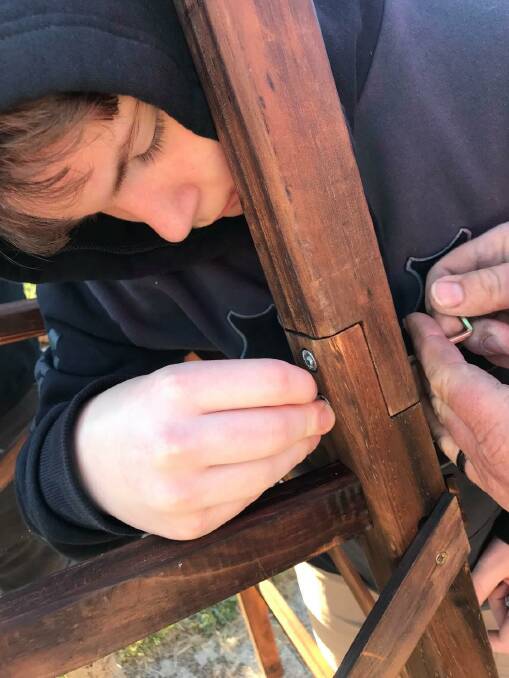 HANDS ON: Sixteen-year-old Cooper Gibson building a windmill as part of his education. Picture: Supplied
