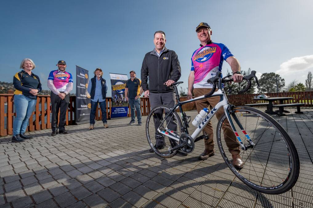 PEDALLING: City Mission chief executive Stephen Brown and Tamar Valley Cycling Challenge chairman Chris Griffin in front of rotarians Naomi Walsh, Tim Lack, Craig Perkins and Alan Harris. Picture: Phillip Biggs