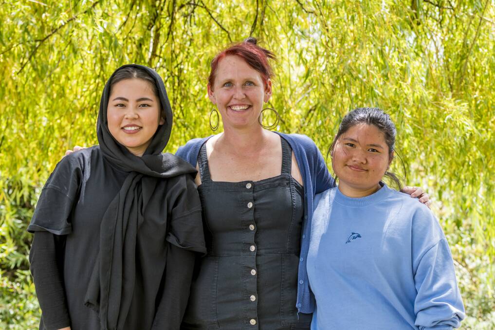 Community Champions Zohreh Jafari and Thadah Shay with multicultural youth Tasmania co-ordinator Sally Thompson (centre). Picture: Phillip Biggs