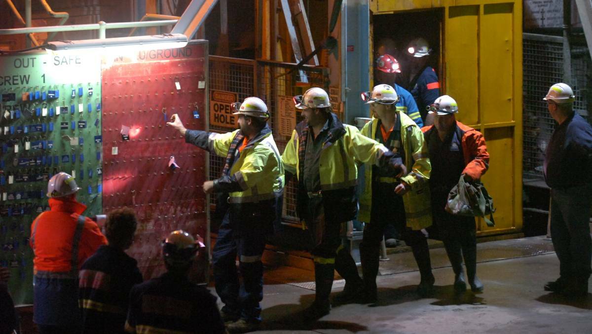 TIME'S UP: Brant Webb and Todd Russell clock out after being rescued from the Beaconsfield mine collapse. Picture: Paul Scambler