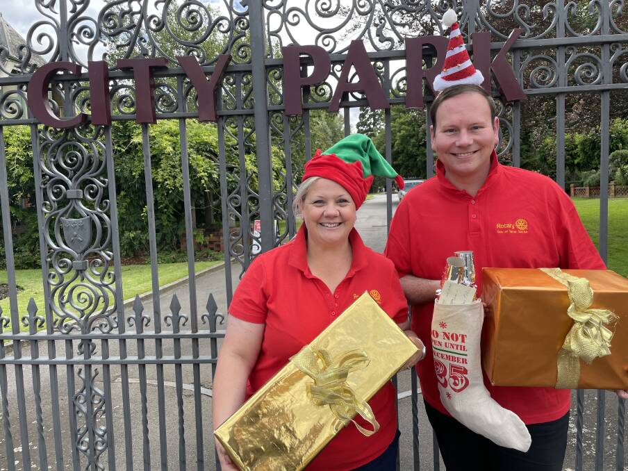 FULL STOCKING: Rotary Club of Tamar Sunrise President Eve Gibbons and Carols chairman Danny Gibson. Picture: Brinley Duggan
