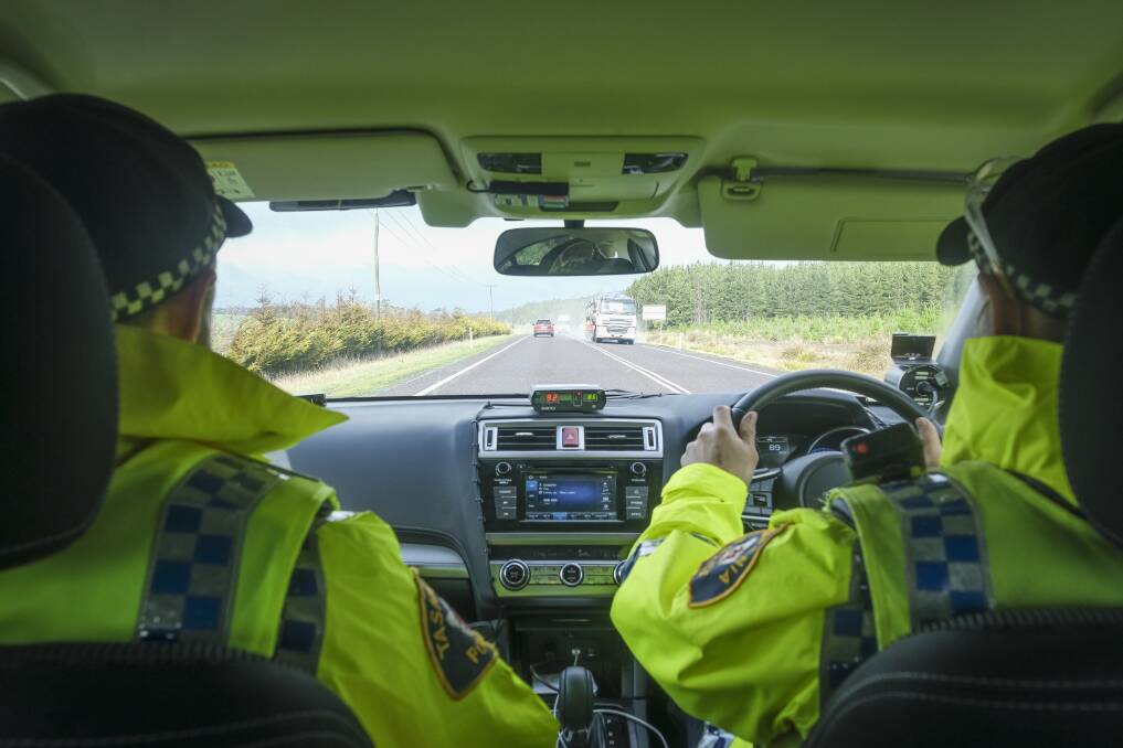 IN FORCE: Two officers patrol the Bass Highway on Wednesday during a police operation. Picture: Craig George