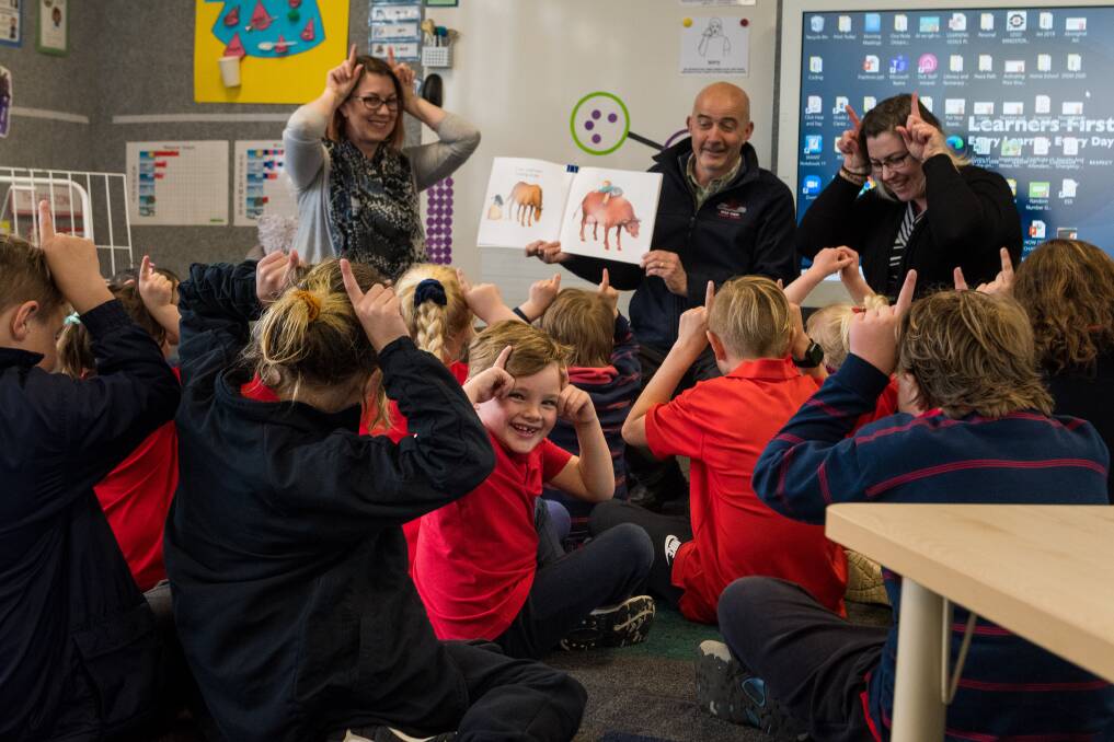 Mole Creek Primary School teachers Stacey Clarke and Michael Bissell, and teacher's assistant Karen Miles teach sign language. Looking back is prep student Mathew Paton. Picture: Phillip Biggs - The Examiner
