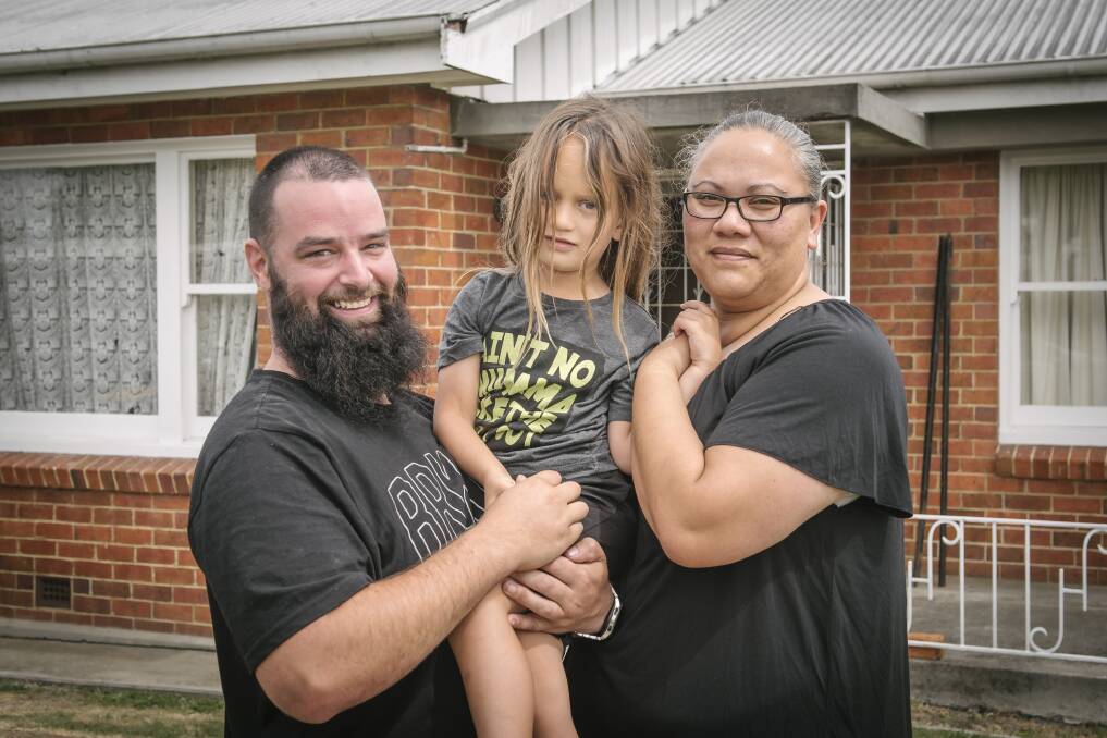 SAFE AND SOUND: Chris, Xavier and Jarline McLachlan at their South Launceston home. Picture: Craig George.