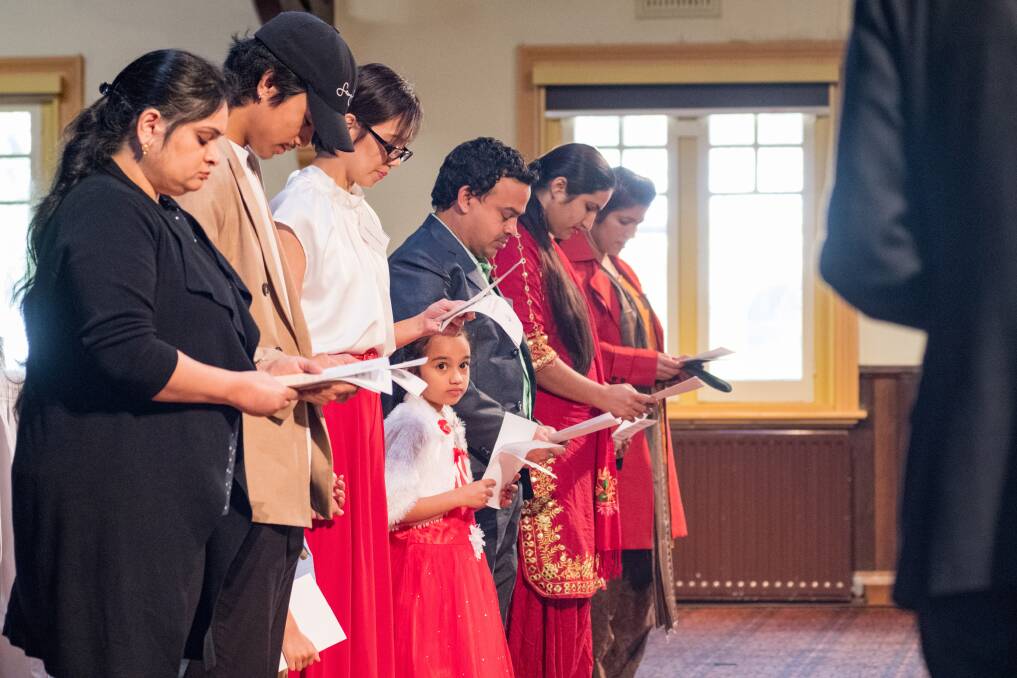 New citizens take an oath at the Launceston citizenship ceremony. Picture: Phillip Biggs