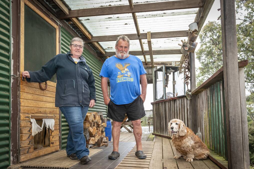 Shack owners Kaye Haywood and Mick Gleeson with dog Benny. Picture: Craig George