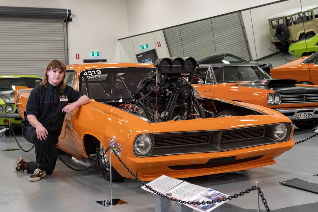 Museum assistant Finn Bosworth with a 1970 Plymouth 'Cuda drag car at the National Automobile of Tasmania Hi-Po exhibition. Picture: Phillip Biggs