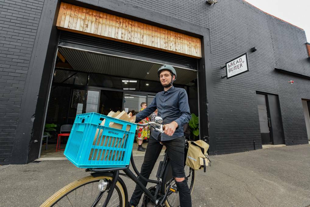 Bread and Butter's Xavier Sherrin, on a delivery bike donated by a cafe regular. Picture: Paul Scambler