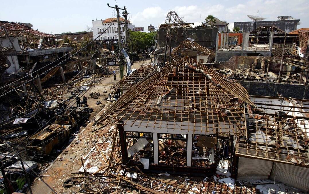 Burnt out cars and destroyed buildings around Paddy's Bar and the Sari Club in Bali after the terror attacks on October 12, 2002. Picture by Mal Fairclough