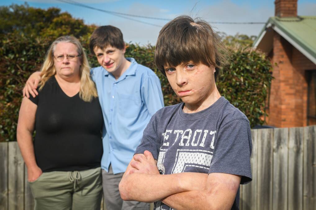 WAITING: Spencer Connelly, 11, with his mother Alison McGee and 15-year-old brother Fletcher 15yr. Picture: Paul Scambler