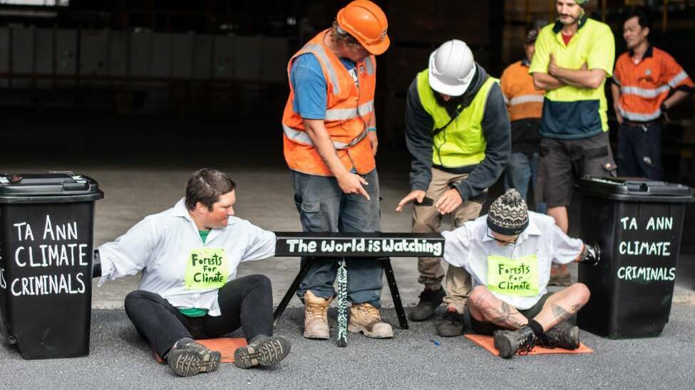 LOCKED IN: Bob Brown Foundation supporters attached themselves to a blockade of the entrance of the Ta Ann mill at Smithton this month. Picture: Supplied