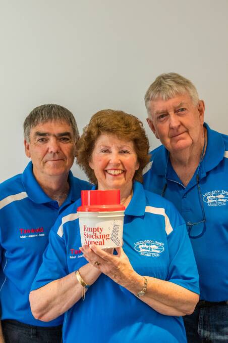 GIVING BACK: Tim Cocker, Rosemary Anderson and Richard Tarr, of the Launceston Scale Model Club, donated funds raised at their expo to the Empty Stocking Appeal. Picture: Phillip Biggs