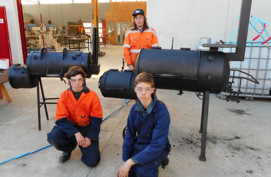 BBQ: Mitchell Hill, Curtis Bailey and Sean Barnett were a part of the St Helens District High School team that took part in making their own barbecue smoker for the Bay of Fires Winter Arts Festival. They finished 10th. Picture: Supplied 