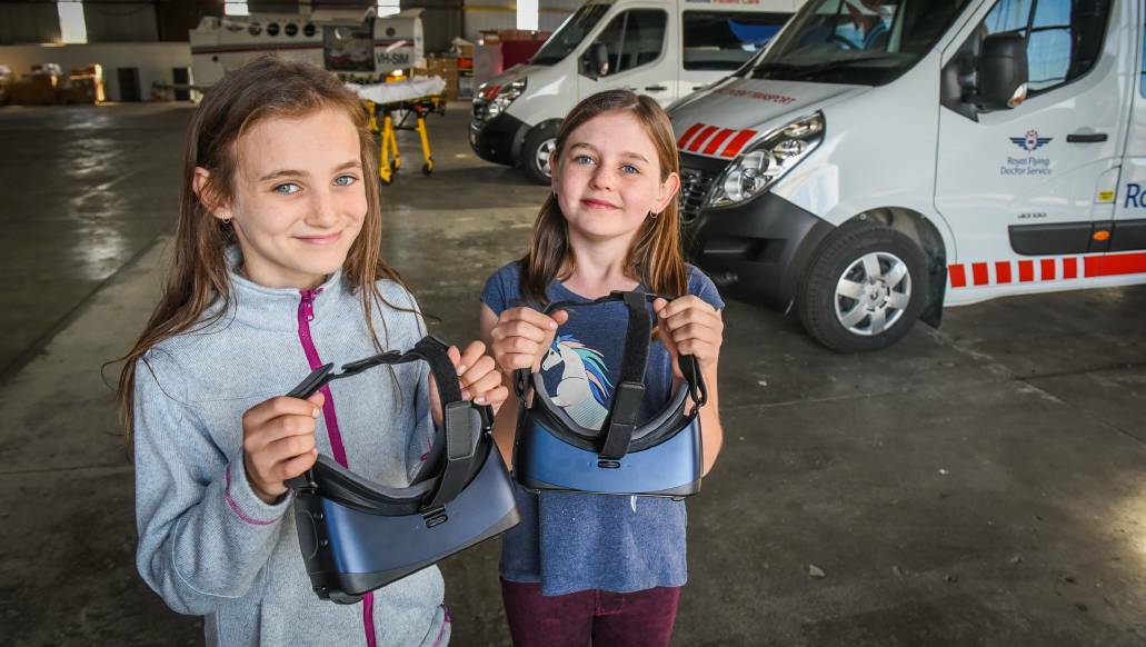 EXCITED: Indiana Carman,11, and Zoe Carman,10, test equipment ahead of Sunday's Royal Flying Doctor Service open day. Picture: Paul Scambler