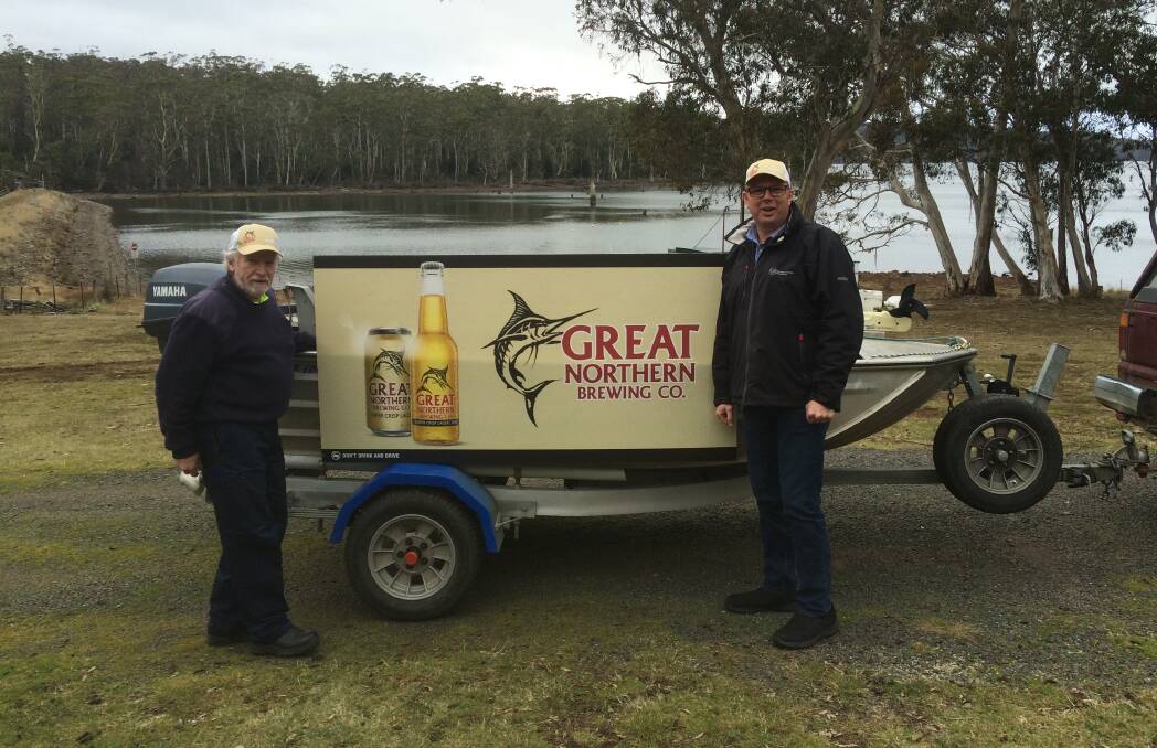 HERE FISHY, FISHY: The Lake Leake Trout Open Day organiser Phil Gorringe and Great Northern Brewing representative Shane Manshanden prepare for the open day on August 3. Picture: supplied. 