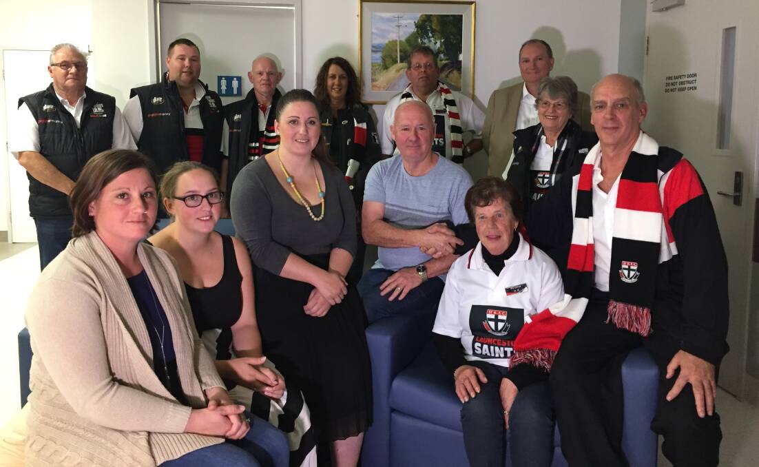 GIVING: After experiencing having a loved one in hospital, the Cooper family, along with the Launceston Saints Supporter Group, have donated two chair beds to the ICU. Pictures: Tarlia Jordan