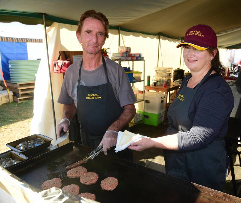 SIZZLE: Peter Bockholt and Kelly Tubb work at the Bracknell Primary School site at Agfest. Picture: Paul Scambler